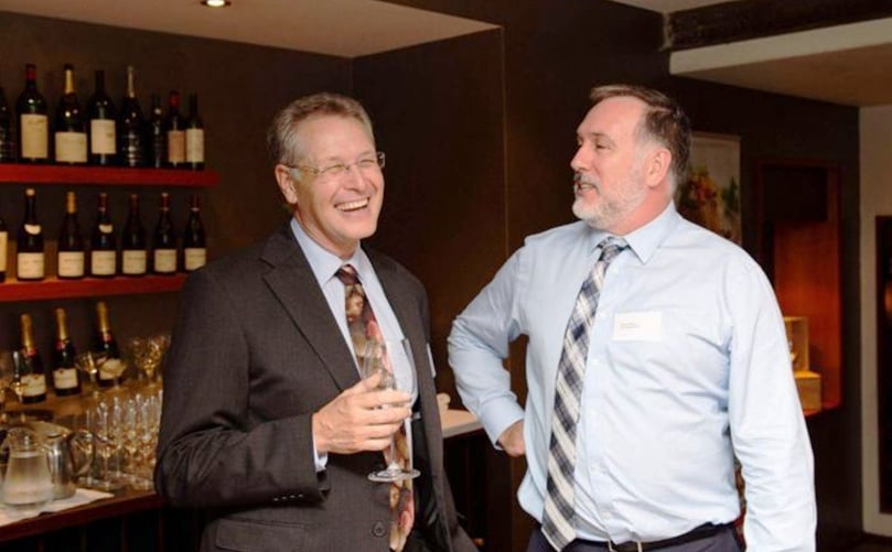 DPIRD's Mark Holland, wearing a potato tie, with WA Potato Growers chief executive Simon Moltoni. (Courtesy: Courtney Holloway / ABC News) DPIRD's Mark Holland, wearing a potato tie, with WA Potato Growers chief executive Simon Moltoni. (Courtesy: Courtney Holloway / ABC News)