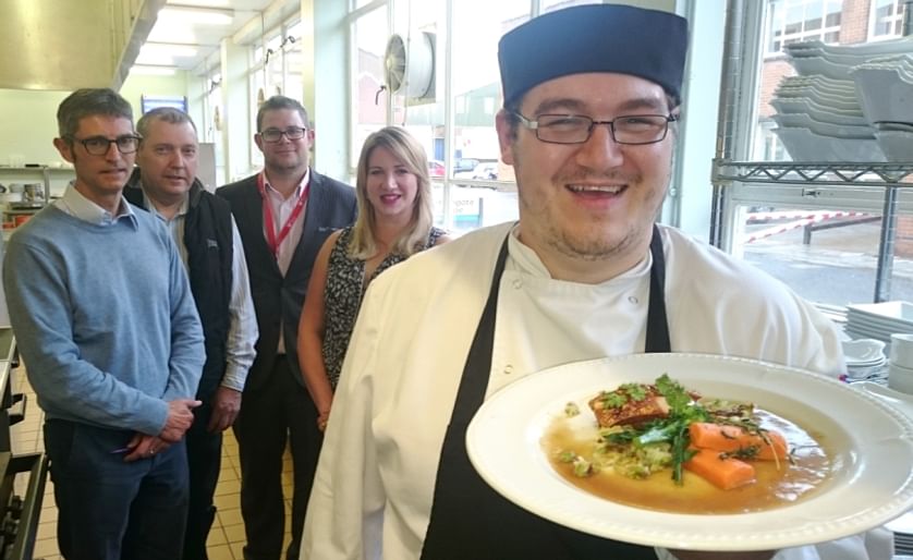 Frazer Coulby (right) - a Harrogate College student - with his winning dish "bubble and squeak with belly pork". His recipe will feature as the main course dish at the BP2015 industry dinner. 
In the background, from left to right: Nick White (AHDB Potat