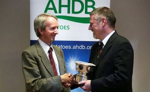 Last year's winner of the British Potato Industry Award, Jim Cruickshank, a well-known Scottish Seed Producer (left) receives the British Potato Industry Award from AHDB Potatoes Strategy Director, Rob Clayton (right) during the Seed Industry Event in St Last year's winner of the British Potato Industry Award, Jim Cruickshank, a well-known Scottish Seed Producer (left) receives the British Potato Industry Award from AHDB Potatoes Strategy Director, Rob Clayton (right) during the Seed Industry Event in St