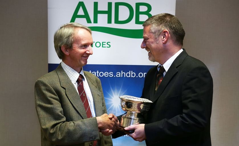Jim Cruickshank, a wellknown Scottish Seed Producer (left) receives the British Potato Industry Award from AHDB Potatoes Strategy Director, Rob Clayton (right) during the Seed Industry Event in St Andrew’s.