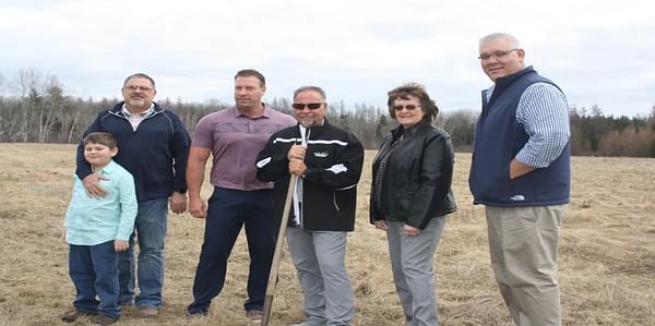The team behind the new Taste of Maine Potato Chip Co. poses on the 30-acre property at Loring Commerce Center where they will construct a new potato chip processing plant. Pictured left to right is James Pelkey, James' son Chance Pelkey, 8, Brad Sargent,