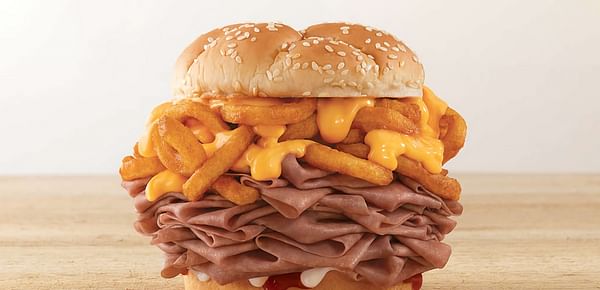 QSR chain Arby`s is testing a massive sandwich stuffed with curly fries: the Arbynator 