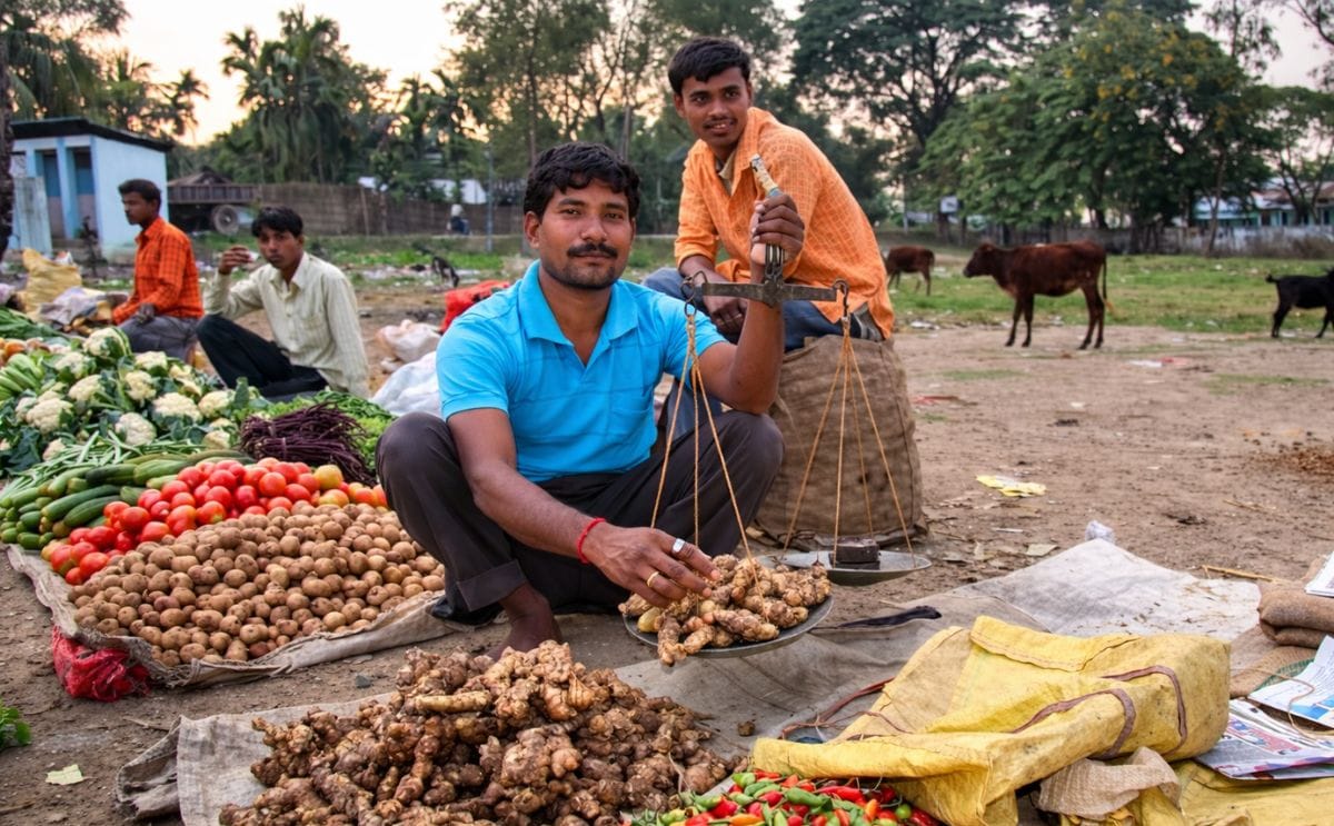 Vegetable vendor on a market in Kohora, Assam, India