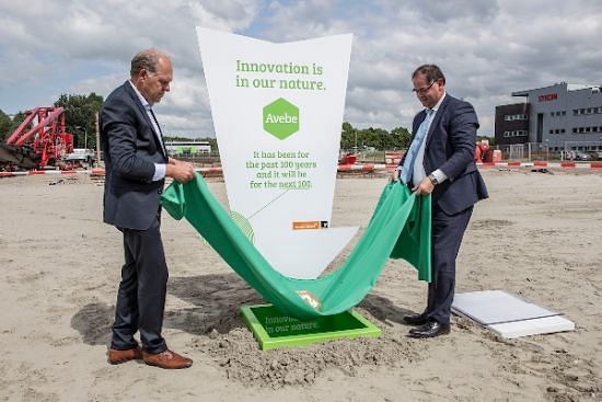 Hans Hoekman, chairman of Avebe’s Supervisory Board (left) and Ed Kraaijenzank, CFO, and vice-chairman of the Avebe’s Board of Directors (right)  'plant' the potato time capsule at the future location of Avebe's Innovation Centre.