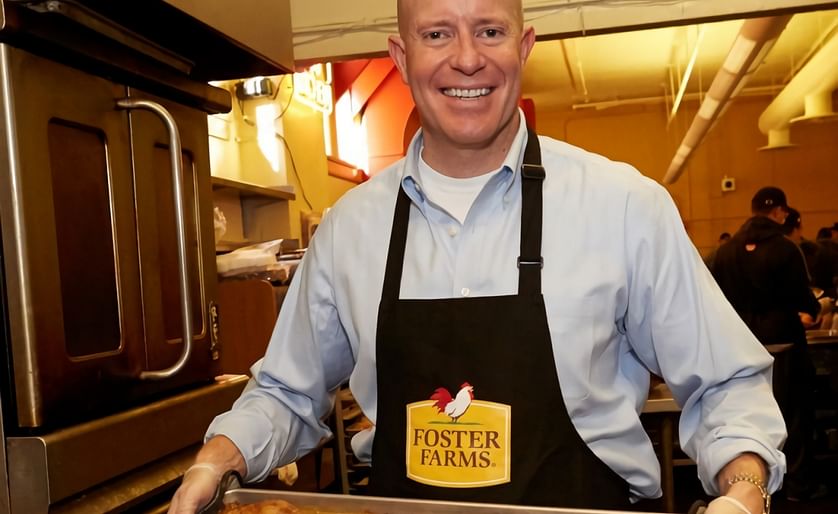Bryan Reese, in his role as SVP at his previous employer Foster Farms, here seen serving chicken at the Foster Farms Bowl