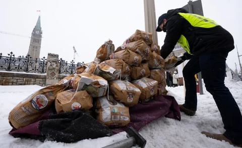 Bags of Prince Edward Island potatoes are unloaded from a transport truck on Dec. 8, 2021, in Ottawa as the potato industry lobbied the federal government to overturn the export ban. Courtesy: Adrian Wyld/The Canadian Press Bags of Prince Edward Island potatoes are unloaded from a transport truck on Dec. 8, 2021, in Ottawa as the potato industry lobbied the federal government to overturn the export ban. Courtesy: Adrian Wyld/The Canadian Press