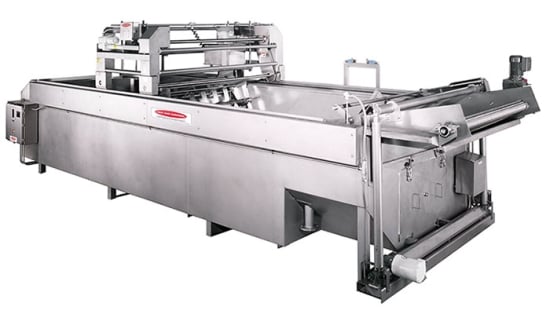 Kettle Chips fryer: potato chips are fried batch by batch