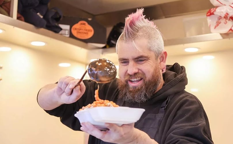 Ben Newman, aka Spud Man, serving one of his now world-famous jacket potatoes at his wagon in Tamworth