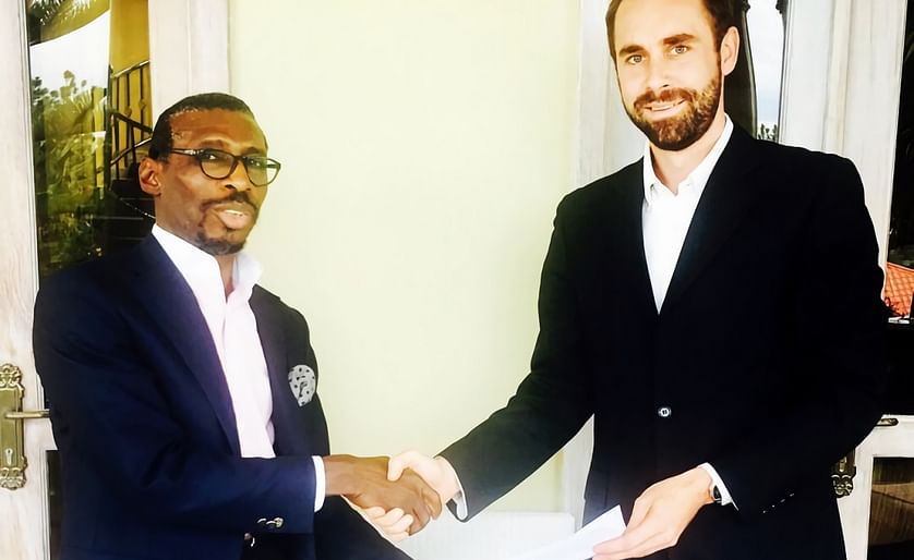 Paul Andrew Olusegun (left) and Mathieu Rouviere exchange documents after signing the takeover deal. BlackPace plans to inject over $10m into chip maker Ndiyo to expand production capacity.