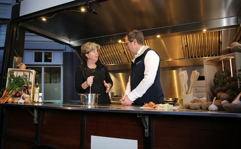 MPs prepare stamppot in the BO Akkerbouw kitchen, surrounded by fresh potatoes and vegetables MPs prepare stamppot in the BO Akkerbouw kitchen, surrounded by fresh potatoes and vegetables