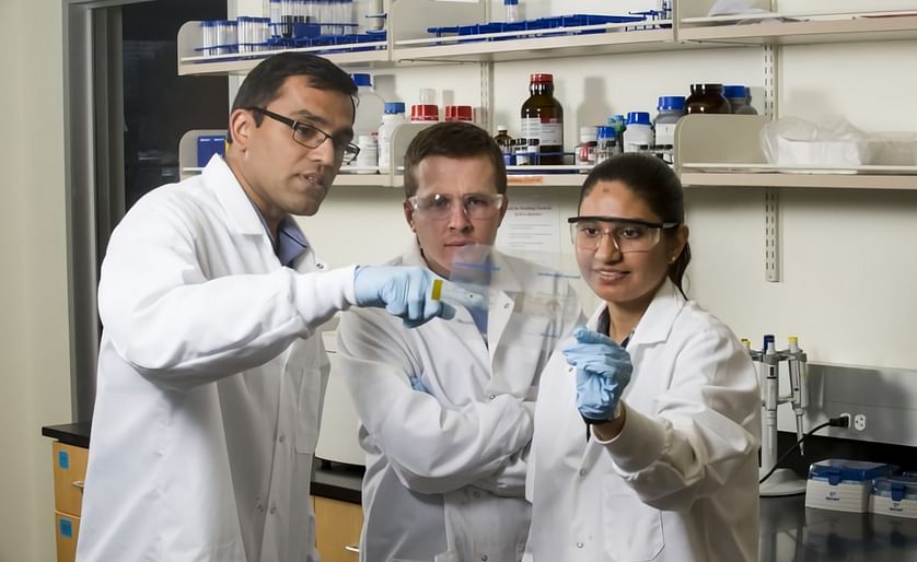 Harish Subbaraman (left) works with graduate students in the Advanced Nanomaterials and Manufacturing Lab of Boise State University.