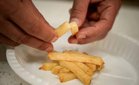 Breeders evaluate the frying quality of experimental potato varieties at the Kabete Laboratory of the University of Nairobi, Kenya. Breeders evaluate the frying quality of experimental potato varieties at the Kabete Laboratory of the University of Nairobi, Kenya.
