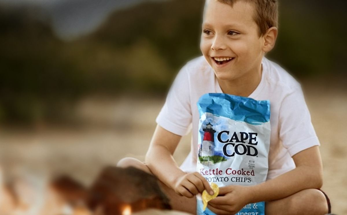 Boy enjoying Cape Cod Kettle Coked Potato Chips Boy enjoying Cape Cod Kettle Coked Potato Chips