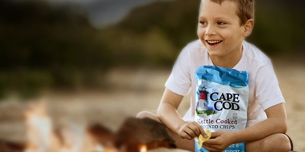 Boy enjoying Cape Cod Kettle Coked Potato Chips