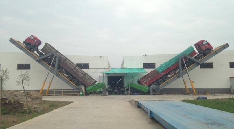 Unloading potato trucks at a potato processing plant in China. Unloading potato trucks at a potato processing plant in China.