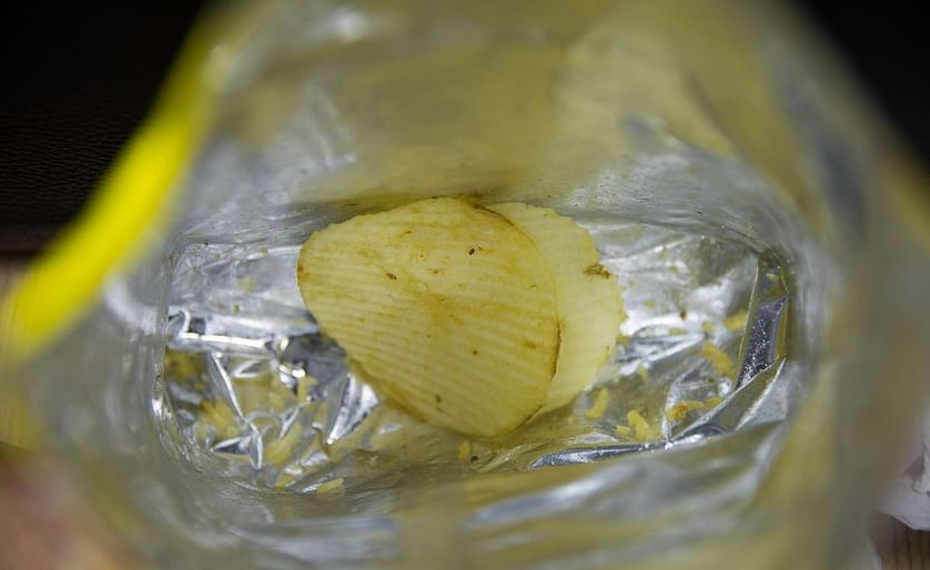 Potato chips and other savoury snacks are typically packaged in bags from metalised films, basically a fusion of plastic and aluminium foil. The metallized coating forms a much better barrier for vapours and light than regular uncoated plastic. Therefore 