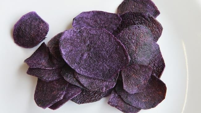 The Scotts have created purple (kettle) chips from their potatoes (Courtesy: Weekly Times / Andy Scott) The Scotts have created purple (kettle) chips from their potatoes (Courtesy: Weekly Times / Andy Scott)