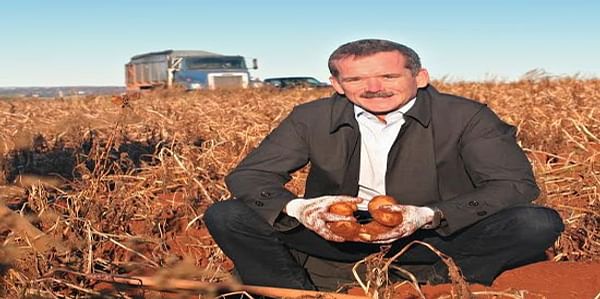 Chris Hadfield digging potatoes on Prince Edward Island