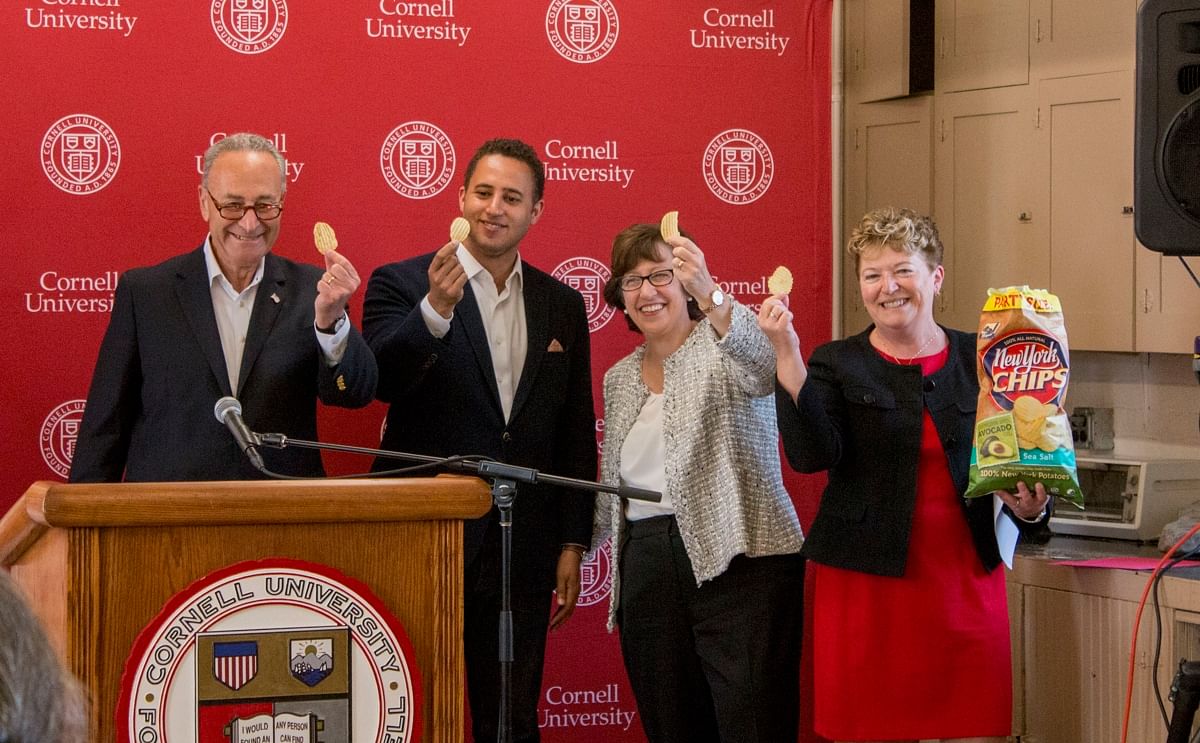 Chuck Schumer proposes a toast on the new Nematode Quarantine laboratory at Cornell University: 'Cheers' - with a potato chip! 
The upgrades to the facilities and equipment will enable the lab to help protect the US potato Industry against this potato pe