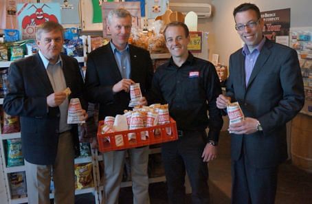 Enjoying Covered Bridge Potato Chips straight from the fryer. From left to right: New Brunswick premier David Alward, MP Mike Allen, Ryan Albright, President Covered Bridge potato Chips, MLA Wes McLean