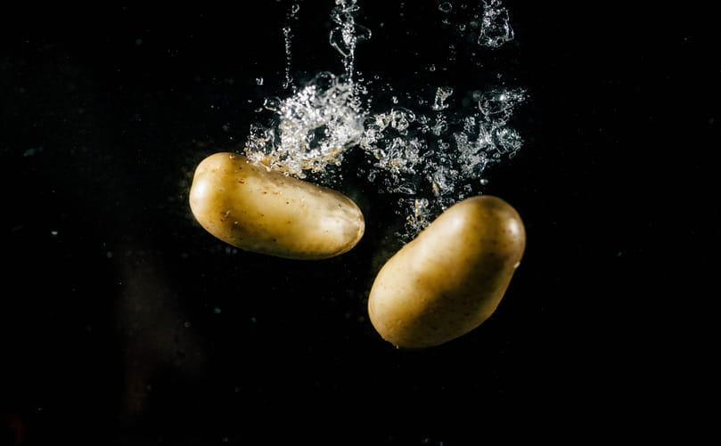 Potatoes Undergoing Water Washing: Initial Cleaning Stage