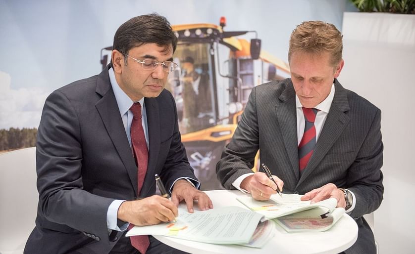 Rajesh Jejurikar, President, Farm Equipment Sector, Mahindra &amp; Mahindra Ltd. (left) and René Boeijenga, CEO at Dewulf (right) signing the agreement during the Agritechnica in Hanover