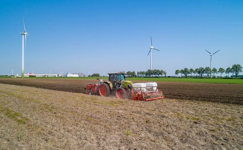Farm Tractor Tilling Soil for Potato Cultivation