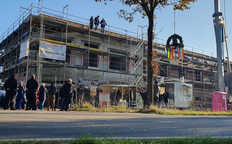 Celebrating the topping-out ceremony at Elea's new headquarters, where the tradition of placing the 'Richtkrone' symbolizes the completion of the building shell. This milestone marks a significant step in Elea's journey as a leader in PEF technology