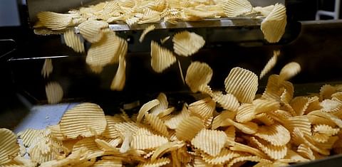 Chips fall off the line at a Shearer's Foods plant in Massillon, Ohio. Courtesy: Lynn Ischay/The Plain Dealer