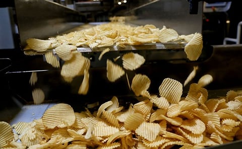 Chips fall off the line at a Shearer's Foods plant in Massillon, Ohio. Courtesy: Lynn Ischay/The Plain Dealer Chips fall off the line at a Shearer's Foods plant in Massillon, Ohio. Courtesy: Lynn Ischay/The Plain Dealer