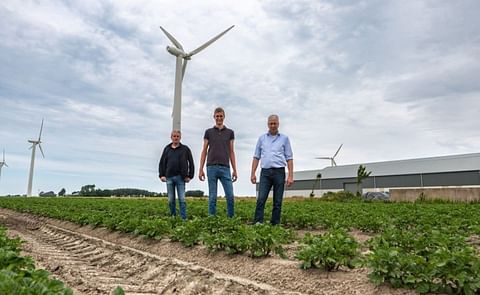 The Schuiling family overseeing sustainable potato cultivation in the Netherlands, with wind turbines symbolizing the integration of renewable energy in agriculture The Schuiling family overseeing sustainable potato cultivation in the Netherlands, with wind turbines symbolizing the integration of renewable energy in agriculture