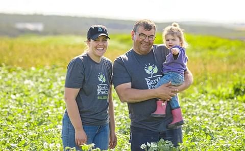 For Keisha Rose Topic, pictured here in one of her potato fields with her father, Boyd, and daughter, Mae, farming is a family business. (Courtesy: Keisha Rose Topic)