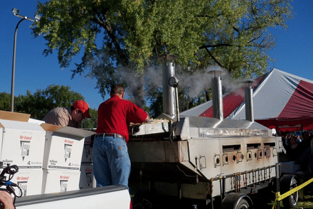 A crew from J.R. Simplot loads the giant fryer with uncooked fries  