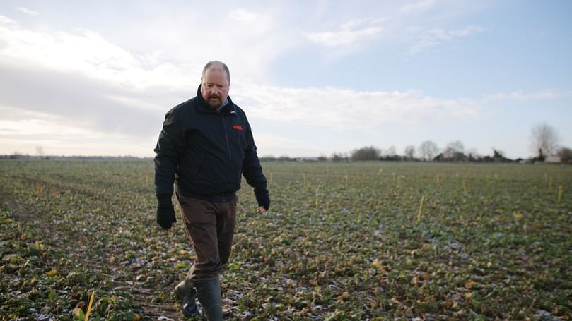 Gareth Jones walking the trial plots