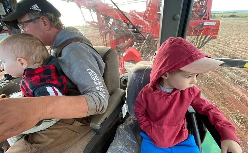 Gaudet's boys in the harvester. Courtesy: Deanna Gaudet