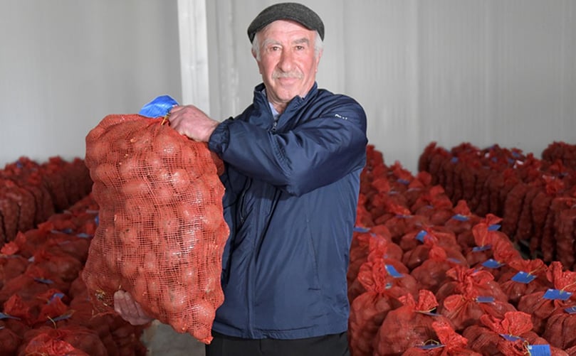 Apetenak Zandarian, a member of the Potato Producer Network in Georgia, holds a bag of disease-free potato seed cultivated at the seed model farm in Akhalkalaki. High-quality seed such as this will increase yields for potato farmers throughout Georgia. The Potato Producer Network was established within the USAID Potato Program. Apetenak Zandarian, a member of the Potato Producer Network in Georgia, holds a bag of disease-free potato seed cultivated at the seed model farm in Akhalkalaki. High-quality seed such as this will increase yields for potato farmers throughout Georgia. The Potato Producer Network was established within the USAID Potato Program.