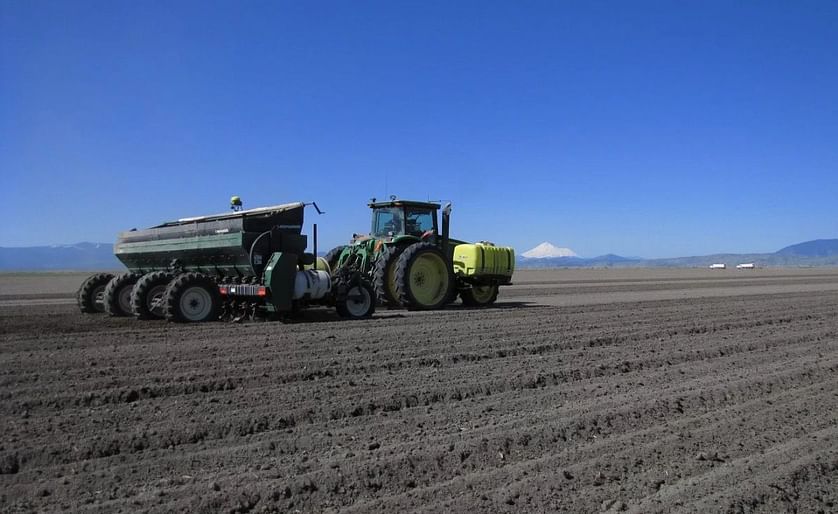 Planting potatoes in Klamath Basin on May 10, 2012. Notice Mt Shasta standing tall and snowy in the background.
(Courtesy: Gold Dust Farms)
