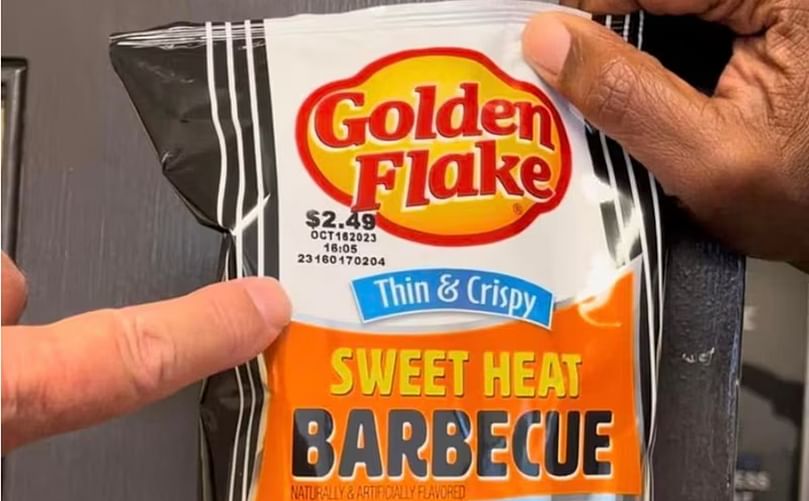 Jeff Clemmons holds up a bag of Golden Flake potato chips from the last day of production at the Birmingham factory on June 9, 2023. Chips from that day are stamped with the expiration date Oct. 16. Any Golden Flake bags stamped with a later date are made in Pennsylvania. (Courtesy:AL.com)