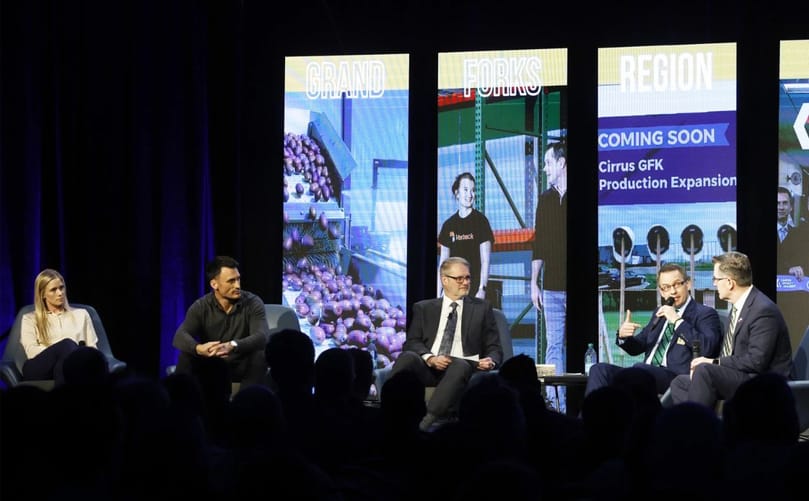 Grand Forks County Commissioner Kimberly Hagen, Mayor Brandon Bochenski, EDC President and CEO Keith Lund, School Board President David Berger and UND president Andrew Armacost participate in the EDC Impact panel on Thursday, March 26, 2026, at the Alerus Center.