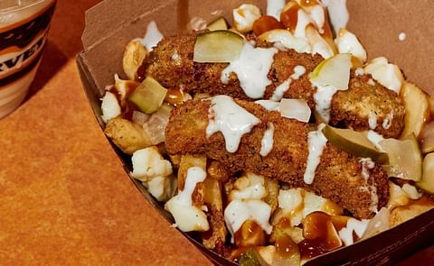 Harvey’s brings back the fan-favourite Pickle Pickle Poutine with a dill-icious update! The Triple Pickle Poutine is made with 100% Canadian cheese curds and potatoes, topped with gravy, two deep fried pickles, diced pickles and now, Garlic Dill sauce. Harvey’s brings back the fan-favourite Pickle Pickle Poutine with a dill-icious update! The Triple Pickle Poutine is made with 100% Canadian cheese curds and potatoes, topped with gravy, two deep fried pickles, diced pickles and now, Garlic Dill sauce.