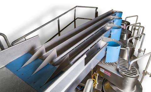 Heat and Control created the space-saving FastLane slicer infeed conveyor which combines the gentle horizontal motion of the FastBack Model 260E-G3 with a multi-lane pan that singulates product for delivery into multiple rotary slicers. Heat and Control created the space-saving FastLane slicer infeed conveyor which combines the gentle horizontal motion of the FastBack Model 260E-G3 with a multi-lane pan that singulates product for delivery into multiple rotary slicers.