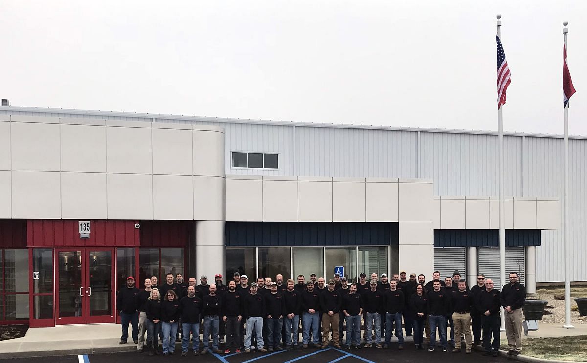 Proud staff posing in front of the newly opened Missouri facilities.