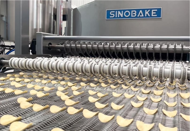 High-speed precision sheeting and cutting system forming uniform compound potato chip shapes for consistent quality and creative product design. High-speed precision sheeting and cutting system forming uniform compound potato chip shapes for consistent quality and creative product design.