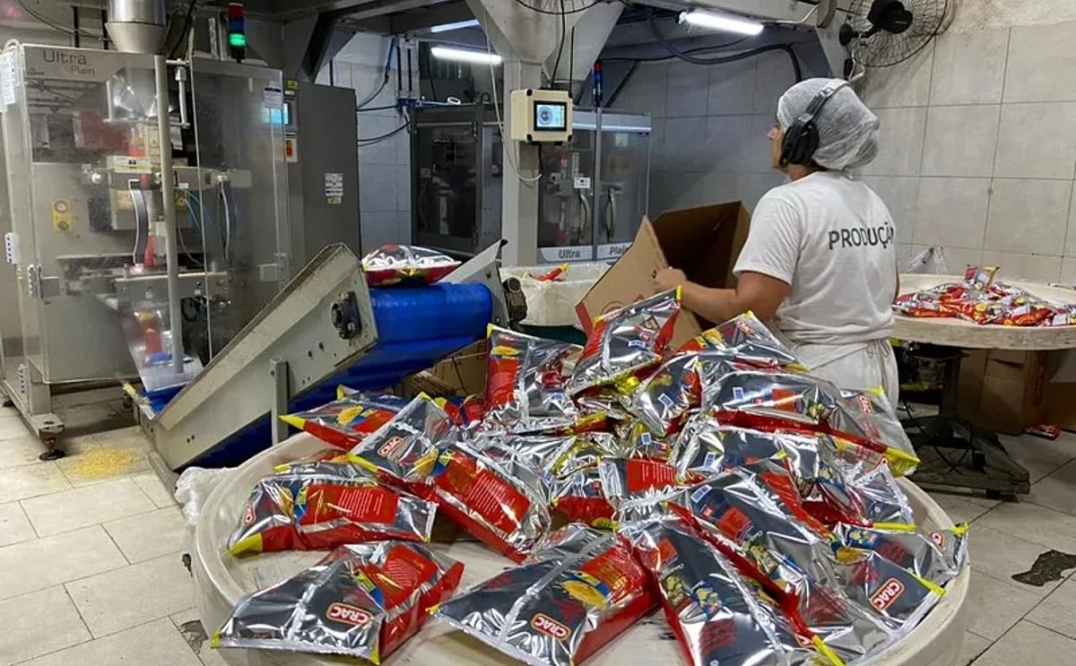 Employees stack products in boxes in Crac