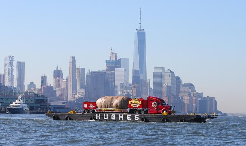 The Big Idaho® Potato Truck floats past Manhattan, in front of the Freedom Tower, NYC in August 2016 The Big Idaho® Potato Truck floats past Manhattan, in front of the Freedom Tower, NYC in August 2016