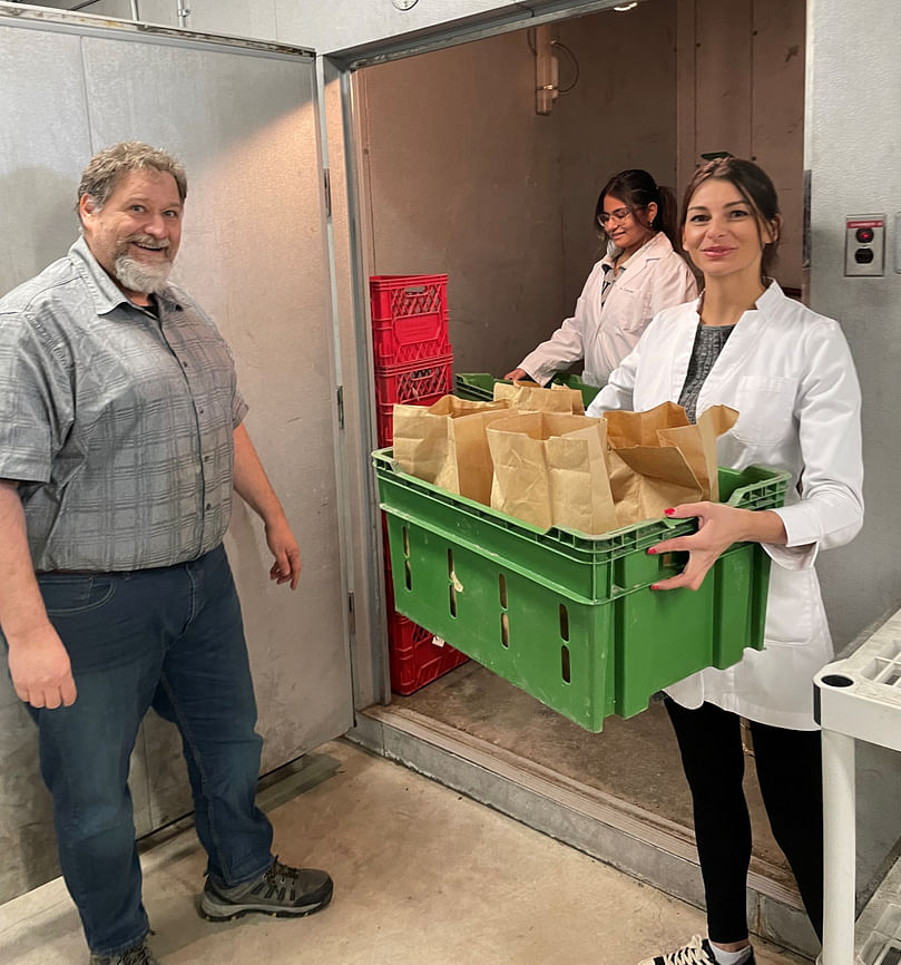 Inside the University of Manitoba Potato Storage Facilities: Mario Tenuta and technicians Shrinal Patel and Fernanda Gouvea Pereira