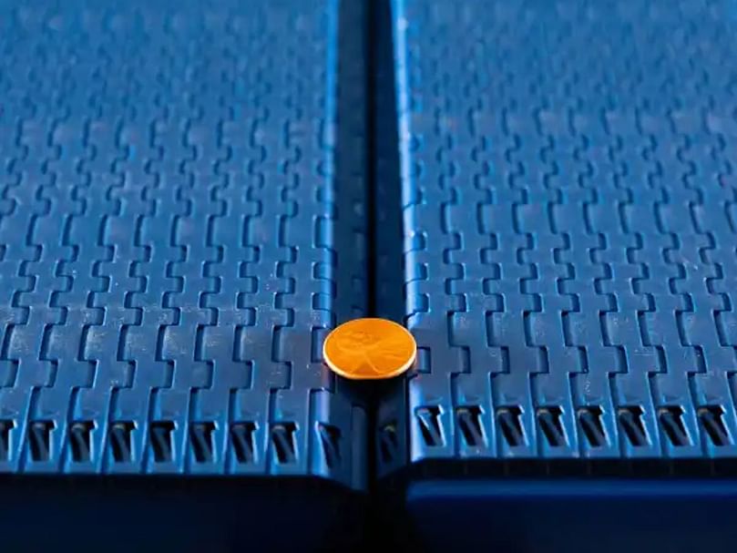 Intralox S570 Tight Transfer Belting: Reduces spoilage by 70%, prevents can stranding, and saves space with minimal transfer gaps. Intralox S570 Tight Transfer Belting: Reduces spoilage by 70%, prevents can stranding, and saves space with minimal transfer gaps.