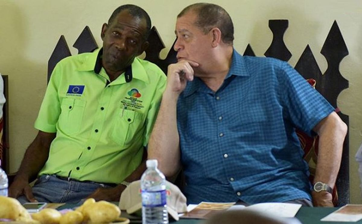 Jamaican Minister of Industry, Commerce, Agriculture and Fisheries, Hon. Audley Shaw (right), speaking with State Minister, Hon. J.C. Hutchinson, at a National Irish Potato Stakeholders Seminar held in Devon, Manchester, on Thursday April 26
(Courtesy: J