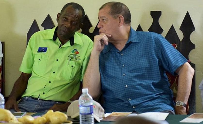 Jamaican Minister of Industry, Commerce, Agriculture and Fisheries, Hon. Audley Shaw (right), speaking with State Minister, Hon. J.C. Hutchinson, at a National Irish Potato Stakeholders Seminar held in Devon, Manchester, on Thursday April 26
(Courtesy: J