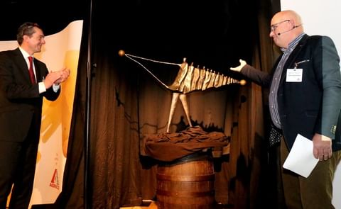 Jan Wolthuis (left) is presented with a sculpture that symbolises connection by incoming chairman Adrie Vermeulen (right). After a 12-year term of service during which Mr Wolthuis fulfilled may board duties, he stepped down as Chairman of Agrico Jan Wolthuis (left) is presented with a sculpture that symbolises connection by incoming chairman Adrie Vermeulen (right). After a 12-year term of service during which Mr Wolthuis fulfilled may board duties, he stepped down as Chairman of Agrico